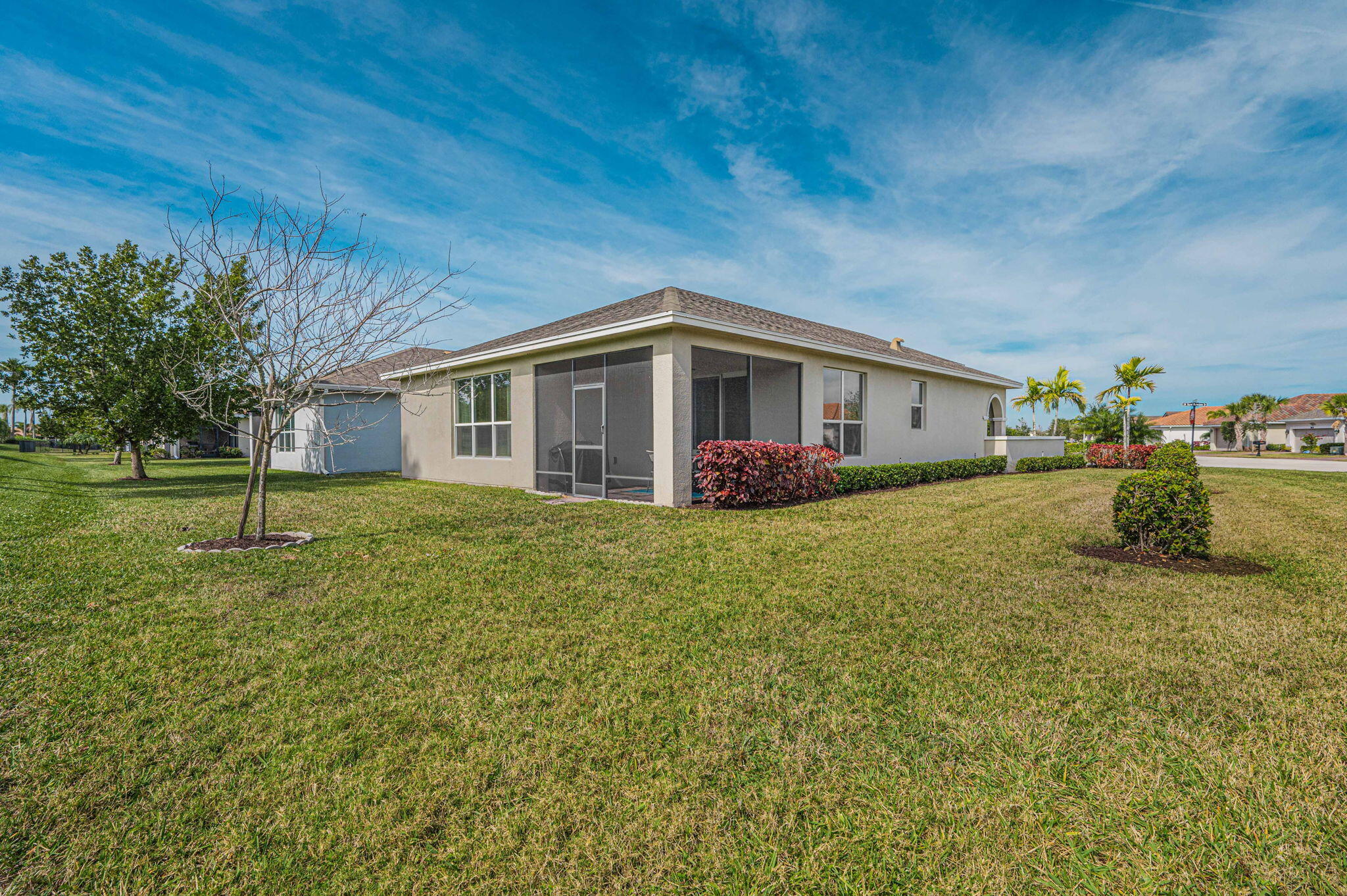 Beautiful, oversized corner lot in the Vitalia gated community of Tradition. If you are a pickleball player this is the place for you! As you enter this home you are greeted with a large open courtyard not found on many units! This home is complete with master suite including large walk in closet, dual sinks and shower. 2nd bedroom with tub bath and den/office or 3rd bedroom with double doors. Center island kitchen with 42in cabinets and granite countertops. Other features include laundry room with extra storage, impact windows and doors, 2 car garage, automatic sprinkler system and screened lanai with plenty of privacy off kitchen.