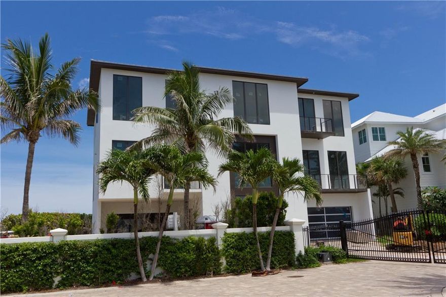 Embrace paradise in this 3-story home boasting panoramic views of the intracoastal & ocean. Currently under construction-scheduled for completion Nov 2025. Experience the best of both worlds, beachfront living & a private dock on the Intracoastal for limitless boating adventures. Elevator access makes every level easily accessible, while the 2nd floor living area offers seamless indoor-outdoor flow to the pool & expansive balcony. Retreat to the top flr bedrooms w/ensuite baths, incl luxurious master suite w/dual walk-in closets. High end appls & luxury finishes reflect the coastal lifestyle.