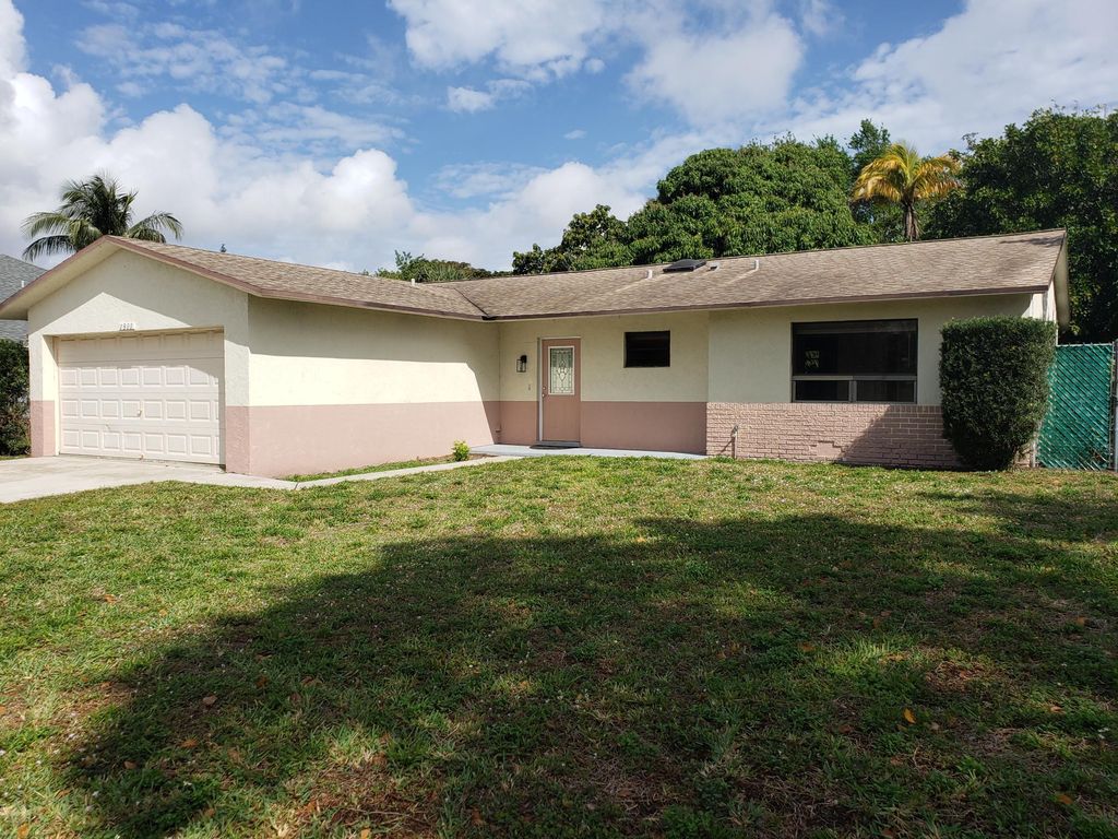 Photo of 1311 N Mangonia Drive, West Palm Beach, FL 33401 (MLS # R11056025)