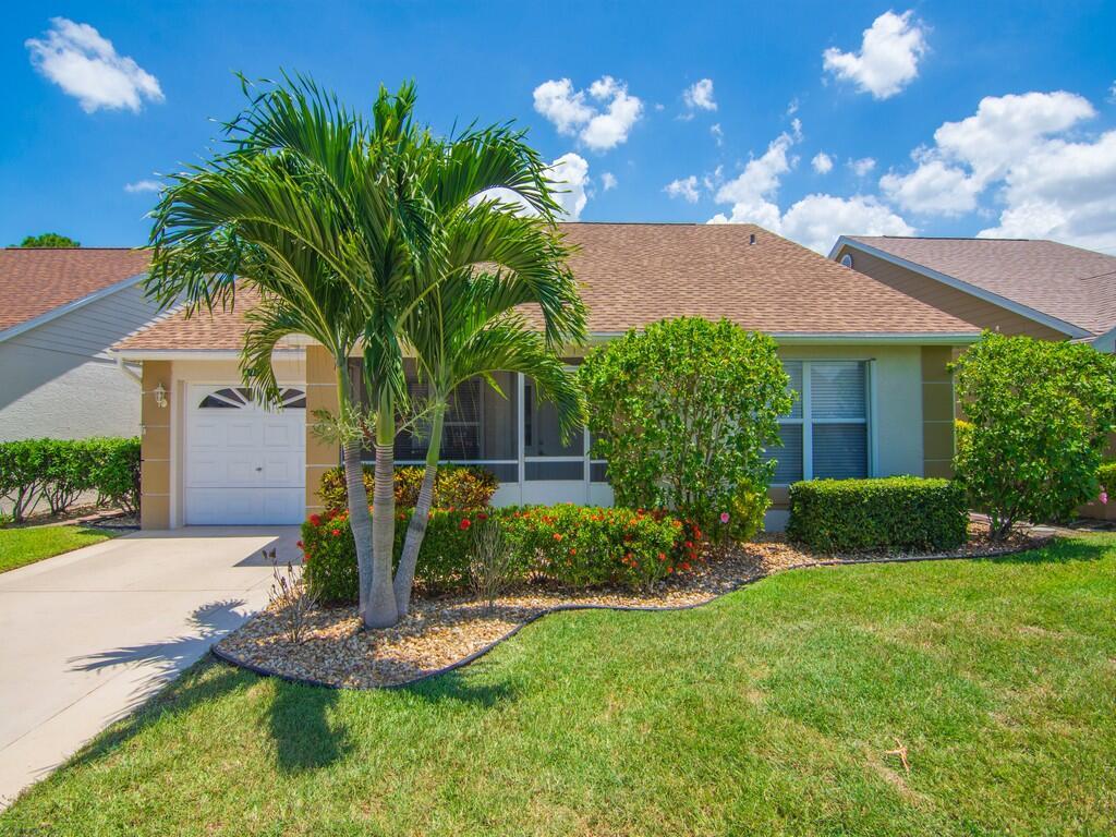 Fabulous home with 2 bedrooms, 2 bathrooms, Den and 1 car garage. Features tile flooring throughout, beautiful, updated kitchen with granite countertops, white cabinets and SS appliances. Updated bathrooms, Accordion Hurricane Shutters, and newer washer and dryer. NEW ROOF 2024, NEW ELECTRICAL PANEL 2024, RE-PIPED PLUMBING 2022, W/H 2021 AND A/C 2014. Enjoy the screened and enclosed lanai, perfect for entertainment. Shed for extra storage, widened driveway, and extra parking across the street. Hassle free HOA includes Lawn care, internet, cable, and managed guard gate. Welcoming Resort Style Clubhouse with Recreational facilities and over 40 clubs and events. Convenient to I-95, banks, grocery stores, medical care and shopping. COME ENJOY THE ROYAL LIFE!
