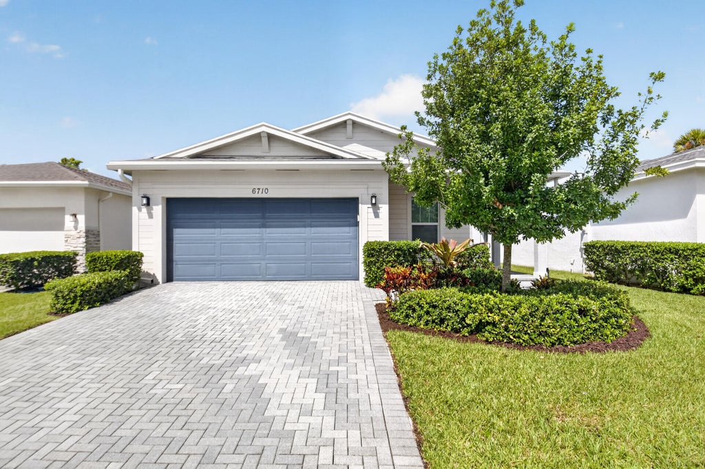 Photo of 6710 POINTE OF WOODS Drive, West Palm Beach, FL 33413 (MLS # B26068797)