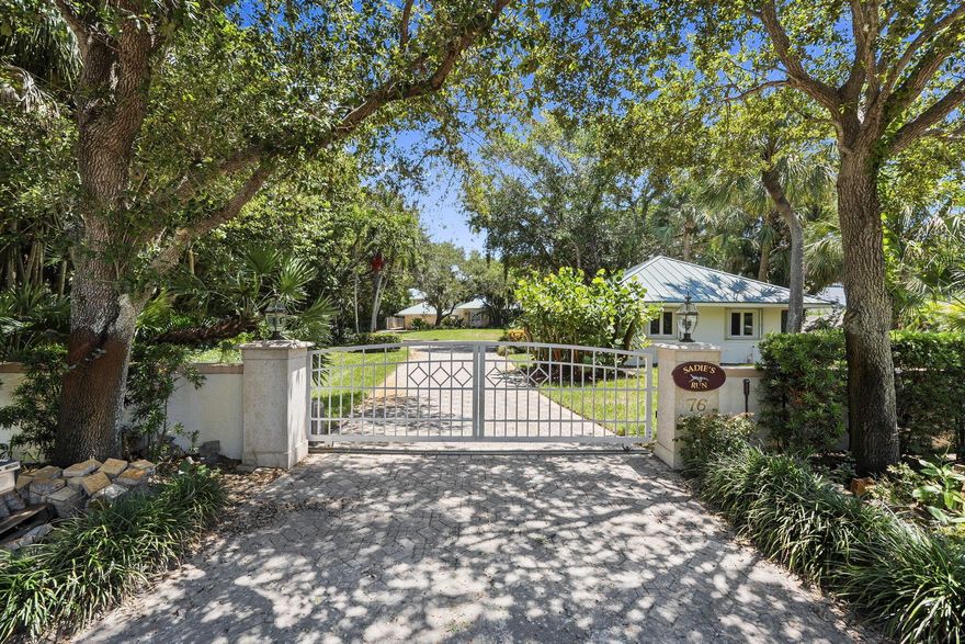 Location, Location, Location!  Prepare to fall in love with your own private, gated estate in the highly sought-after community of South Sewall's Point. Completely fenced with an electronic entry gate, this extraordinary property offers unmatched privacy and stunning 180 unobstructed views of the Intracoastal Waterway, with easy ocean access via the nearby inlet. What truly sets this property apart is the separate, fully equipped guest house, featuring its own kitchen, living room, bedroom, and private entrance--ideal for extended family, guests, or even rental income. The main residence is full of character and architectural charm, with multiple vaulted ceilings, a custom-designed front entry door, and high-end finishes throughout.