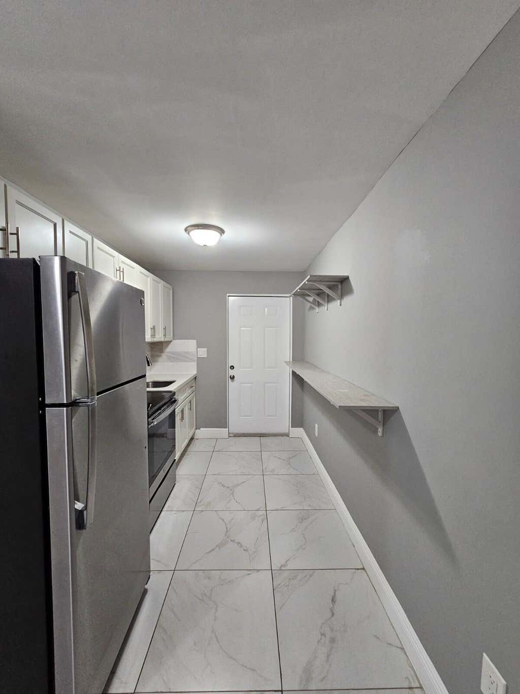 Photo of 933 W 7th Street #A, Riviera Beach, FL 33404 (MLS # B26064714)