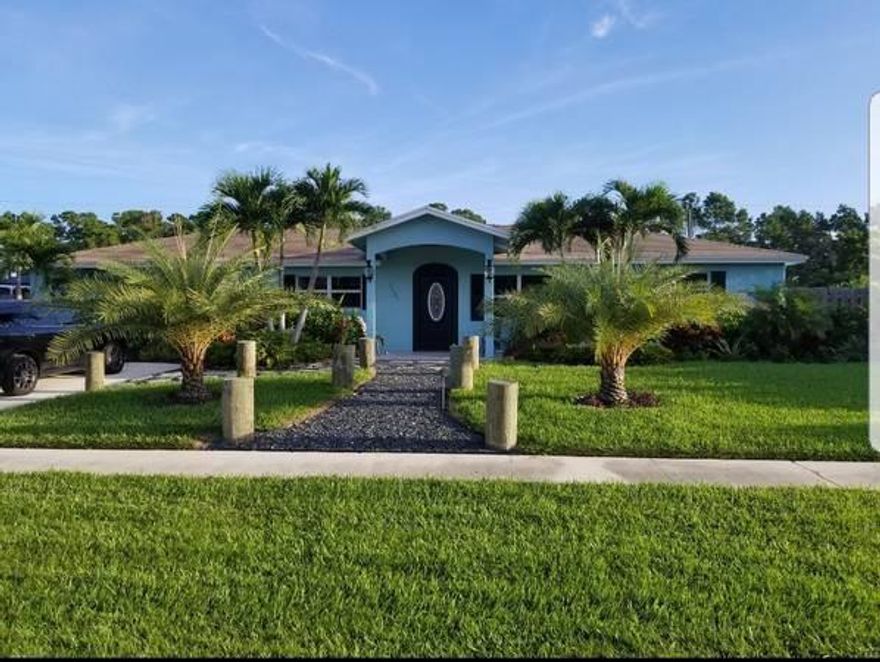 Completely Renovated in 17' Single family home on large lot. Large open floor plan with custom built in home theater with 72inch LED T.v. Large Master suite and bath with walk in shower. Custom kitchen with granite tops and stainless Steel appliances.Completely fenced in backyard with brick paver patio and 6 person Jacuzzi. Upgraded 5 ton AC unit with all duct work replaced. Hurricane windows & doors throughout, roof replaced in 05'.10 x 20 Hurricane rated Storage/Workshop.