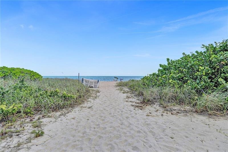 Florida Beachfront Living, let the ocean hit your feet and the sand be your seat at this renovated Condo located in the exclusive & boutique Sea Ranch Lakes walking distance to Lauderdale By The Sea, shops & restaurants. Over 1k sqft. 24x48" Porcelain Tile Floors, All new upgraded Custom Kitchen w/appliance package including washer/dryer, Hurricane Impact Windows. Custom Cabinets in Kitchen & Bathroom. Marble Tile Shower, all new plumbing & electrical fixtures, new upgraded appliance package w/washer & dryer. Tons of natural light with southern exposure. Walk Out Patio to Heated Pool, Covered Parking includes Cable TV, plenty of guest parking and EV Charging private secured entrance, amenities including fitness center overlooking the beach, , Suana, BBQ's,  Clubhouse, Updated Building