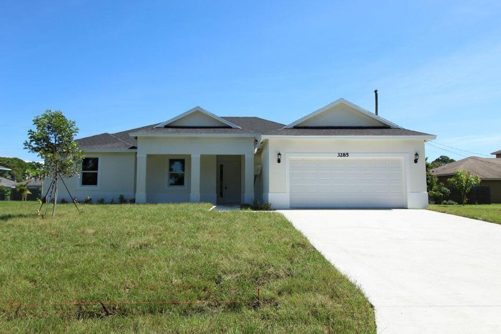 Photo of 5808 NW Erin Avenue, Port Saint Lucie, FL 34986 (MLS # R10784318)
