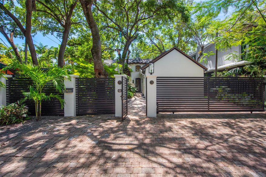 Nestled in the lush and vibrant community of Coconut Grove, this charming 3-bed, 3-bath gated home epitomizes luxury and convenience.  Professionally designed interiors flooded with natural light complement an open family & dining area that’s perfect for entertaining.  The living room boats 20ft beamed ceilings and the outdoor patio was remodeled (Jan 2024) with new stone and turf creating an inviting space for outdoor gatherings and relaxation.  The roof was replaced in Oct 2023 and features copper accents for timeless elegance. With its prime location of being within the coveted boundaries of the area's most sought-after public schools, impeccable design, and recent upgrades, this Coconut Grove gem presents an unparalleled opportunity to embrace South Florida living.