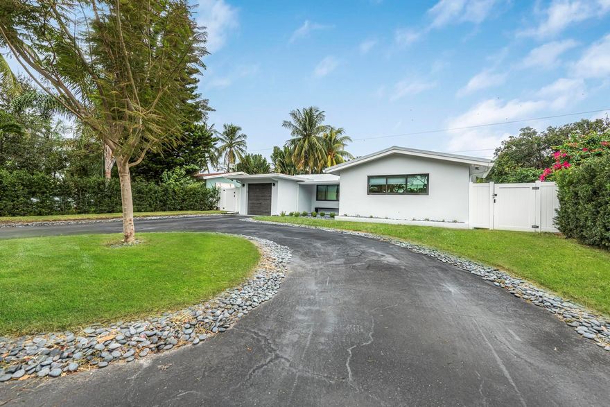 Amazing opportunity to live on one of the most desirable streets in Lighthouse Point. This Single Family home offers the BEST floor plan and open space concept with HIGH END FINISHES throughout the entire home and lot! Enjoy this spectacular NEWLY REMODELED 3 Bedroom, 2 Full Bathroom home with a MASSIVE living room, OPEN & Airy Arched Doorways, Formal dining room/den, perfect spacious laundry room, BRAND NEW METAL ROOF (STRAPPED), New HURRICANE IMPACT Windows & Doors/Garage Door, Brand New Electrical Panel, New High-Hat lighting, Brand New A/C, New Plumbing, BRAND NEW Irrigation Systems, Tankless Hot water heater, and a FINISHED GARAGE! Fully fenced in yard for your family/pets!  Enjoy NO HOA, Able to AIRBNB OR VRBO as much as you would like! This home is perfect for anything you want!! Discover the pinnacle of recreational excellence at Lighthouse Point, boasting state-of-the-art pickleball, basketball, and tennis courts. Nestled in the heart of South Florida, it stands as the region's most coveted community, a well-guarded gem awaiting exploration. Revel in seamless access to pristine beaches, top-tier gyms, quaint coffee shops, convenient grocery stores, enriching libraries, picturesque parks, and beyond!