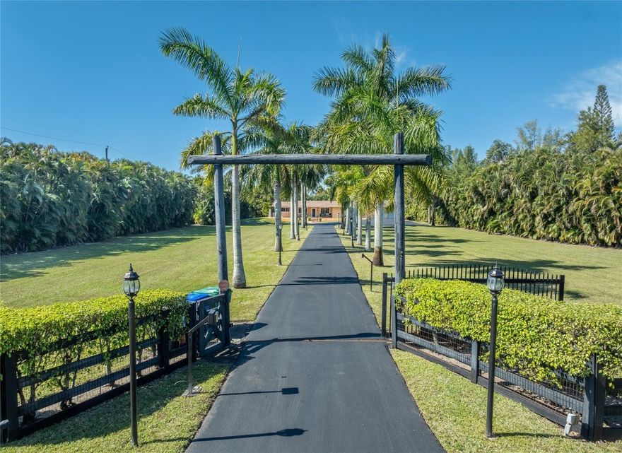 99% Vacant Home! ESTATE PRICED UNDER MARKET VALUE & A TAD OVER LAND VALUE FOR QUICK SALE! Set on a beautifully Landscaped & Private 2.4-Acre Lot on coveted Thoroughbred Lane in SUNSHINE RANCHES! A Long, Royal Palm-lined Driveway leads to a spacious 4/4.5 Main Home, detached 1/1 Guest House (750 sq. ft.) & Furnished Office Building (547 sq. ft.). This Estate offers: 4 Terraces, full Summer Kitchen, Pool, Hot Tub, equipped Gym, 60KW Generator & expansive Front & Rear Yards. Whether you're hosting guests or working from home, this Captivating Compound is ideal for Entertaining & Entrepreneurship! Impeccably maintained! Move-in Ready with incredible potential to personalize, expand, or even rebuild on one of Sunshine Ranches' most prestigious streets. A rare opportunity to own a true Gem! NOTE: Main home is concrete block construction with cedar siding. Siding can be removed by Buyer and home stuccoed at Buyer's preference.