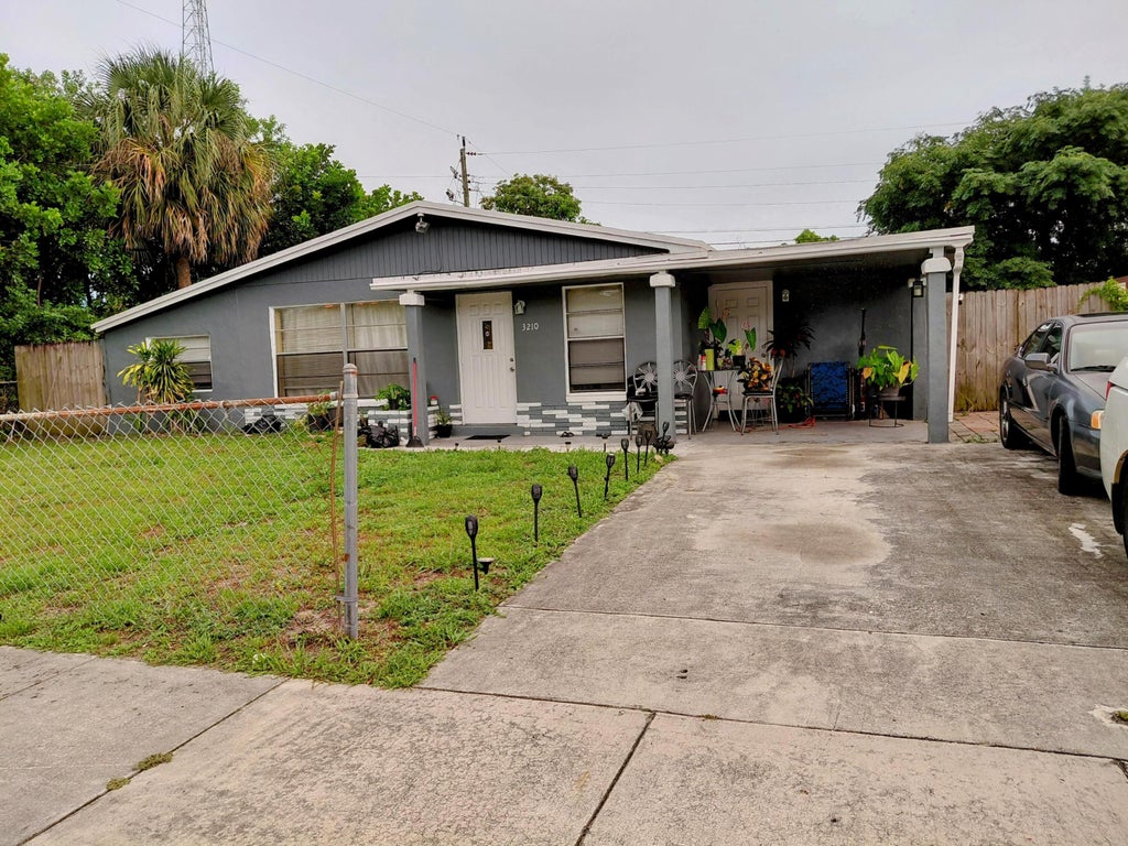 Photo of 3210 NW 18th Place, Lauderhill, FL 33311 (MLS # B26042997)