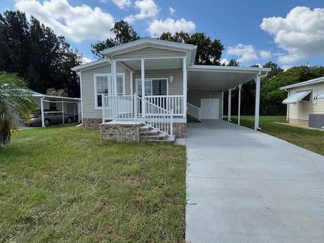 This brand-new 2025 manufactured home offers modern living in a secure, 55+gated community with 24-hour security. Featuring 2 bedrooms, 2 bathrooms, and 800 sq. ft., this home is thoughtfully designed for comfort and convenience. The open-concept kitchen boasts a spacious island, stainless steel appliances, and plenty of counter space, making it perfect for cooking and entertaining. Enjoy peaceful outdoor living with front and rear porches, along with a carport for easy parking.Residents have access to a clubhouse, community pool, and included amenities such as internet, cable TV, and lawn care. Conveniently located just minutes from shopping areas, this home offers a stress-free, low-maintenance lifestyle in a quiet yet accessible location.