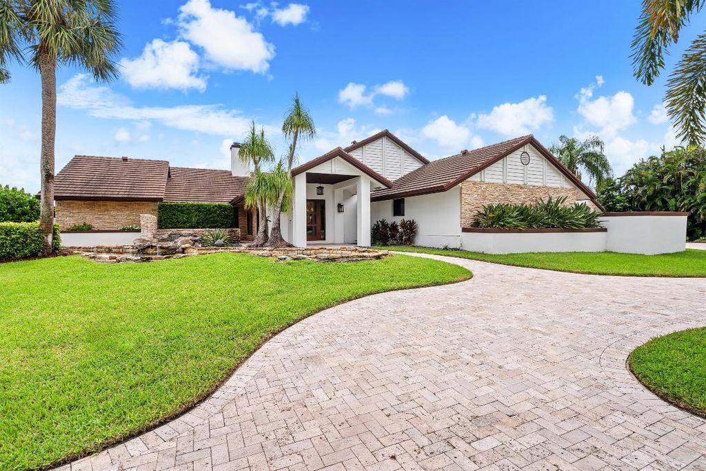 Photo of 910 Greensward Lane, Delray Beach, FL 33445 (MLS # R11122166)