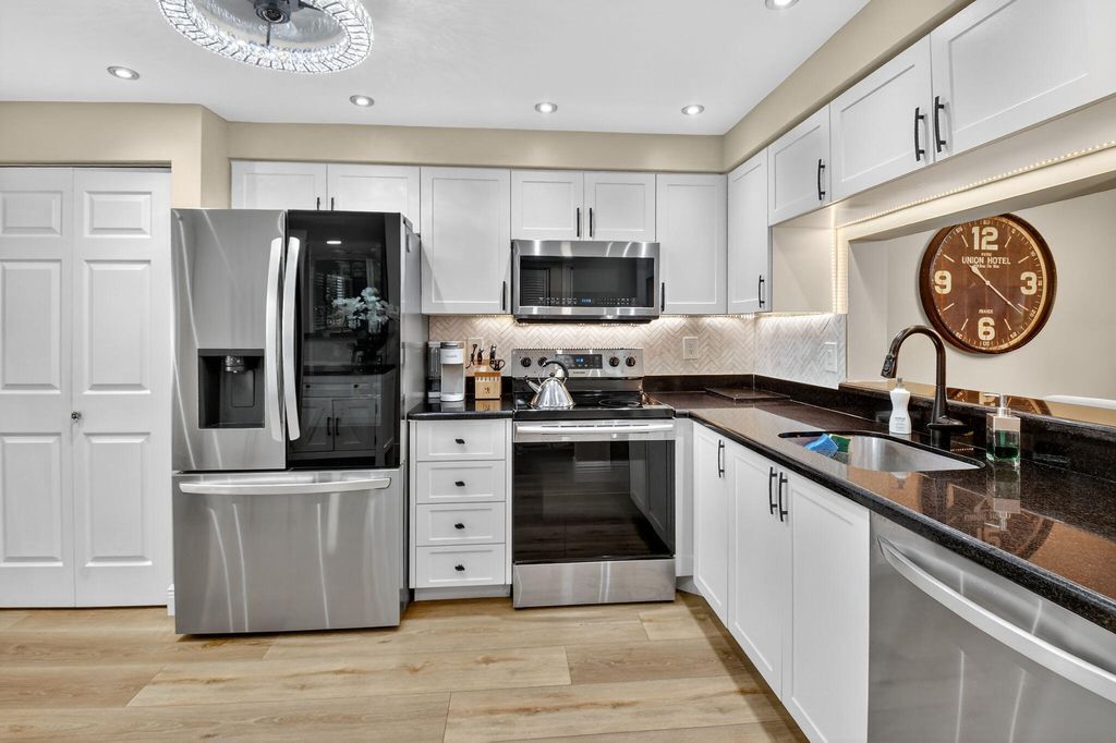 Photo of 7270 Ashford Place #104, Delray Beach, FL 33446 (MLS # R11103179)