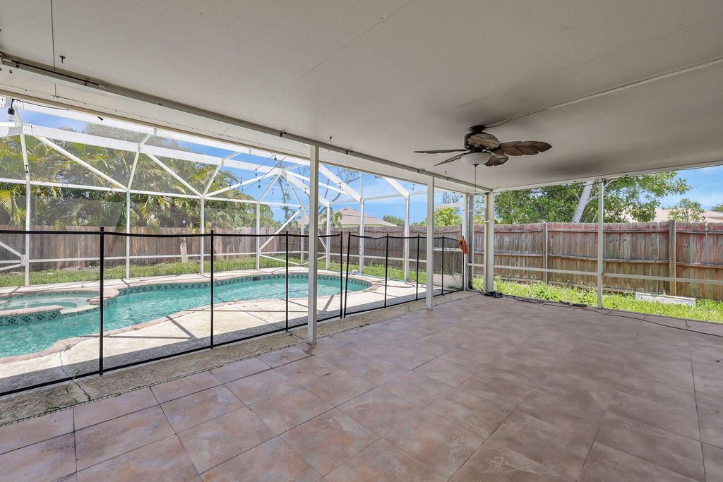 Photo of 1889 SE Gaskins Circle, Port Saint Lucie, FL 34952 (MLS # R10978689)