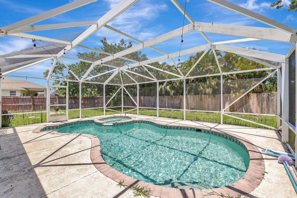 Photo of 1889 SE Gaskins Circle, Port Saint Lucie, FL 34952 (MLS # R10978689)