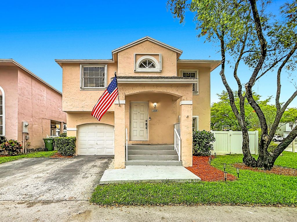 Photo of 12028 NW 13th Street, Pembroke Pines, FL 33026 (MLS # B26003095)