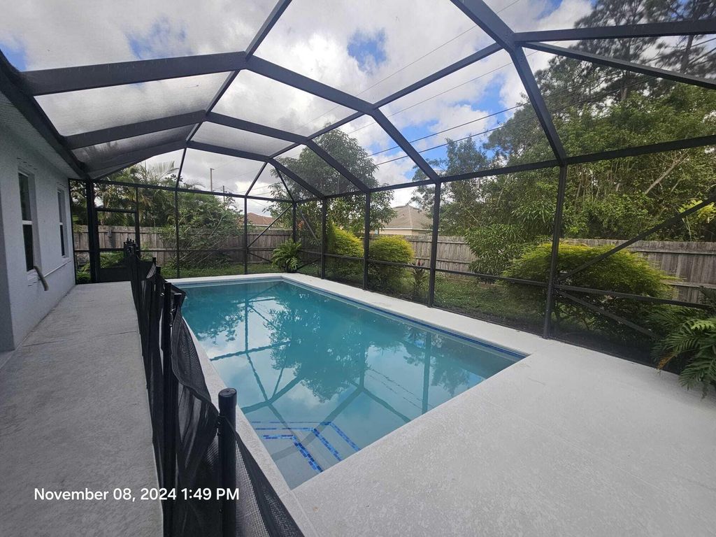 Photo of 3925 SW Kakopo Street, Port Saint Lucie, FL 34953 (MLS # R11035988)