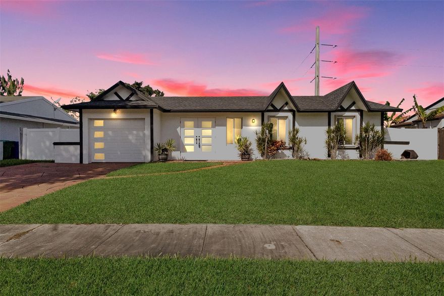 This beautifully maintained 3-bedroom, 2.5-bath waterfront home offers comfort, efficiency, and serene canal views. Enjoy a spacious primary suite featuring a separate shower, soaking tub, and bidet. Laminate flooring enhances the bedrooms, while wood-look tile flows through the main living areas. Updates include a 3-year-old AC and roof, some impact windows and doors with accordion shutters on remaining openings. Kitchen is equipped with stainless steel appliances, pantry storage. Appliances include washer, dryer, refrigerator, oven, and dishwasher, plus an energy-saving water heater on a auto timer for efficiency. Relax or entertain on the huge screened porch overlooking a fenced yard with canal-fed sprinkler system. South Florida living at its best. No HOA