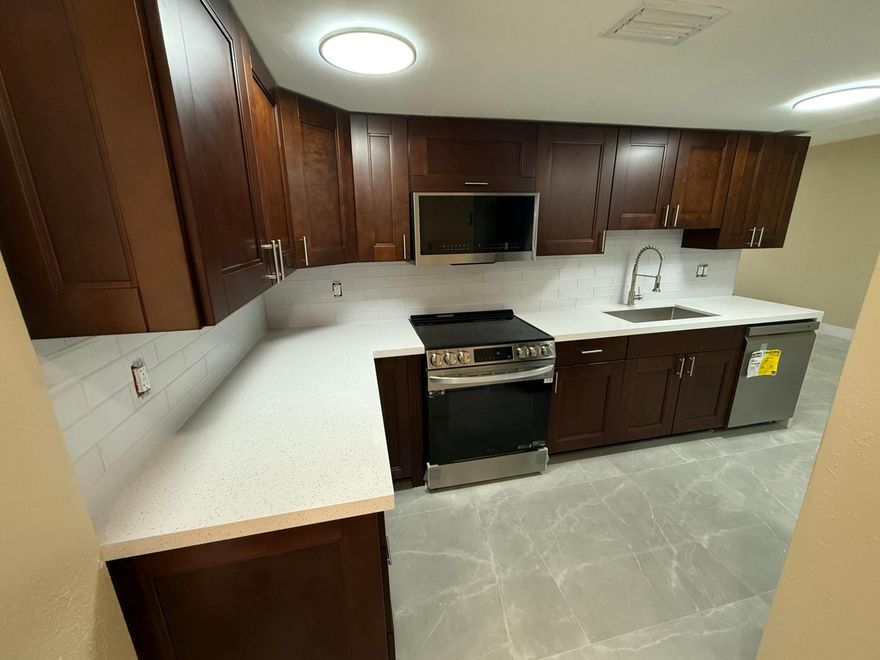 Available April 1, 2026. Requirements first, last, and security deposit, plus cleaning fee. Move-in ready home has been fully updated from top to bottom featuring new flooring, modern kitchen with granite countertops and stainless steel appliances, and refreshed bathrooms throughout. Spacious bedrooms with plenty of natural light. Conveniently located near public transportation, major expressways including I-95 and SR-836, and minutes to Wynwood's world-class shopping, dining, and entertainment.