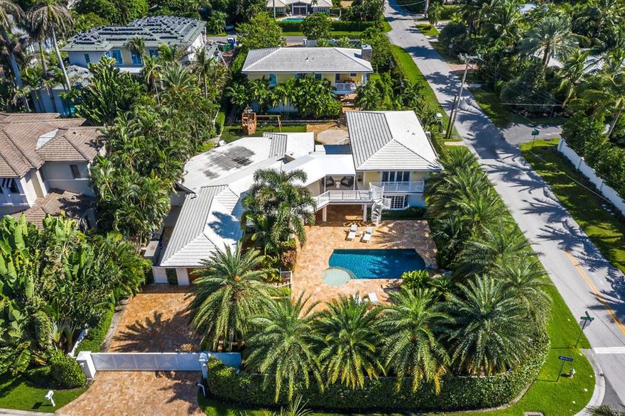 1137 Vista Del Mar is a one of a kind gated estate located in the North Beach section on the barrier island of World-Famous Delray Beach. Commanding 2 lots totaling nearly 3/4 of an acre, this beach side compound has a main house with 4 bedrooms, 4.5 baths spread over 4178 living square feet and a newly built detached 3714 sq ft 3-bed 2.5 bath guest house. Both the main home and guest home are totally updated to today's high-end luxury standards and hurricane preparedness with generator and impact windows. Interior highlights include neutral stone and wood finished floors, glazed limestone finished bar area for entertaining and stunning gourmet chef's kitchen with stainless appliances and white quartz counter tops. Embrace the Florida lifestyle and outdoors in total privacy in your very ow tropical oasis. A luxury setting reminiscent of an island resort you find a multitude of outdoor escapes, a tropical pool with rock waterfall, giant covered patio with summer kitchen and fireplace, tot play area finished with a pirate ship and synthetic turf, and a second story deck with hot tub. All located within a couple blocks from Atlantic Avenue and the beach, 1137 is a rare double lot multi home opportunity providing privacy, luxury, convenience so you can live who you are.