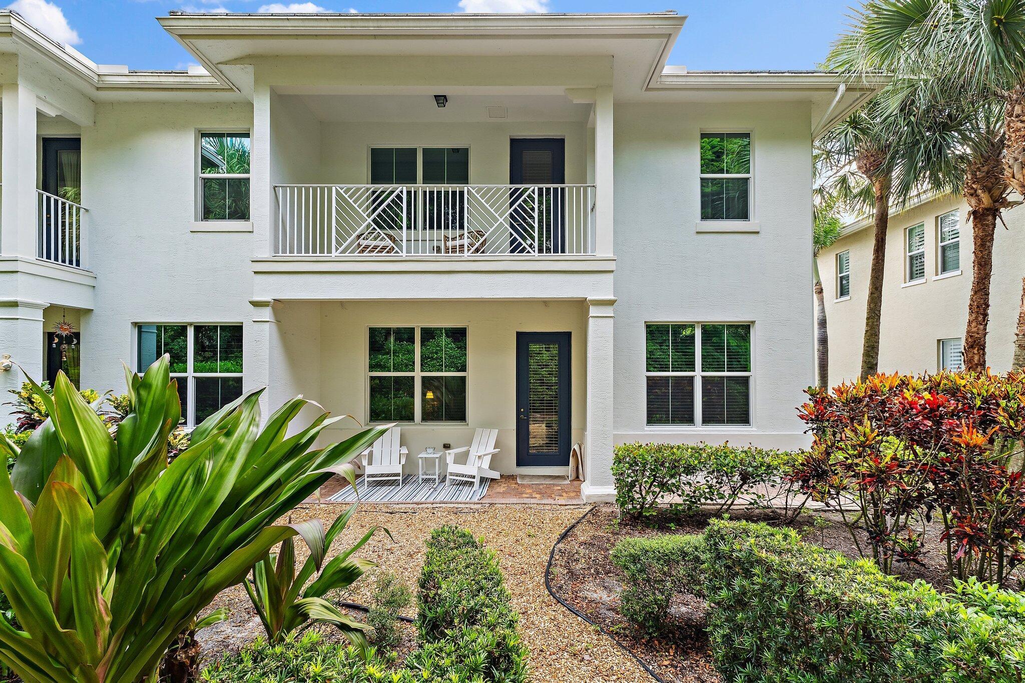 Welcome to 4033 Kingston Lane, a beautifully updated, 2 story corner townhome in the desirable gated community of Hampton Cay. This spacious residence offers 3 bedrooms, 2.5 bathrooms, a 2-car garage, and over 2100 Sf of living space, with all-impact windows and approximately $100k in upgrades. The open concept layout features tile flooring throughout the main living areas, luxury carpet upstairs, and a modern kitchen with stainless steel appliances, perfect for both everyday living and entertaining. A stunning custom built-in wall anchors the large family room, which opens to a private patio, ideal for relaxing, dining, or hosting guests. Upstairs, all bedrooms are conveniently located together, including a laundry room and the expansive primary suite with a large balcony, 2 walk-in