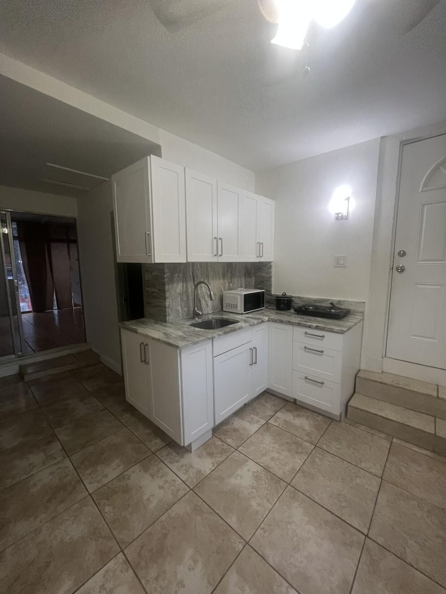Efficiency available April 15th! Located east of I-95 in desirable East Oakland Park, just 5 miles from the beach. This private unit has been freshly painted and features a spacious bedroom, bathroom, and an updated kitchen. Enjoy ceramic tile flooring throughout. Residents have access to a shared laundry room with washer and dryer, as well as a patio area perfect for relaxing outdoors. The property also offers a lush, tropical-style yard and access to a shared pool—ideal for enjoying South Florida living.