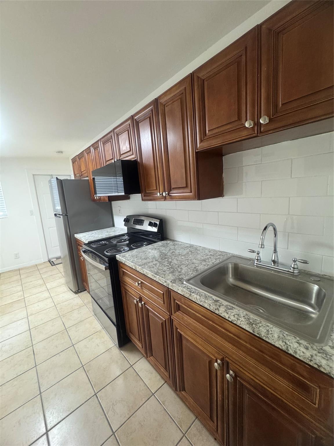 Updated 1/1 east of Broadway in the Riviera Beach marina district. Just west of the Blue Heron bridge and walking distance to the beach.