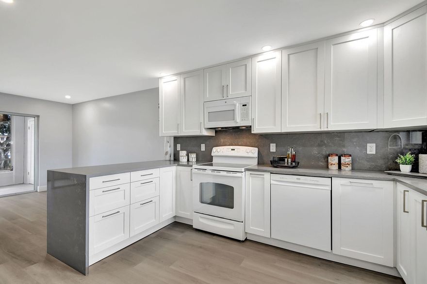Beautifully renovated 1-bedroom, 1.5-bathroom in an exclusive 55+ community! Water, Internet, Basic cable included. Available 12/15/25. This condo has modern upgrades and a sophisticated design, creating the perfect retreat for comfortable living. Step into an open-concept kitchen featuring quartz countertops, luxurious 40-inch soft-close cabinets with convenient pull-outs for optimal storage, and a spacious layout ideal for entertaining. The entire space is floored with high-quality luxury vinyl, offering both elegance and durability, while LED lighting fixtures provide a warm ambiance throughout. A new A/C system ensures year-round comfort. This apartment combines style and functionality, with every detail thoughtfully designed for ease of living. Schedule a tour today!