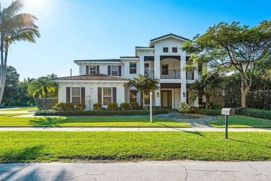Just listed! Coastal estate on an oversized corner lot just blocks away from the fun of Mizner Park.