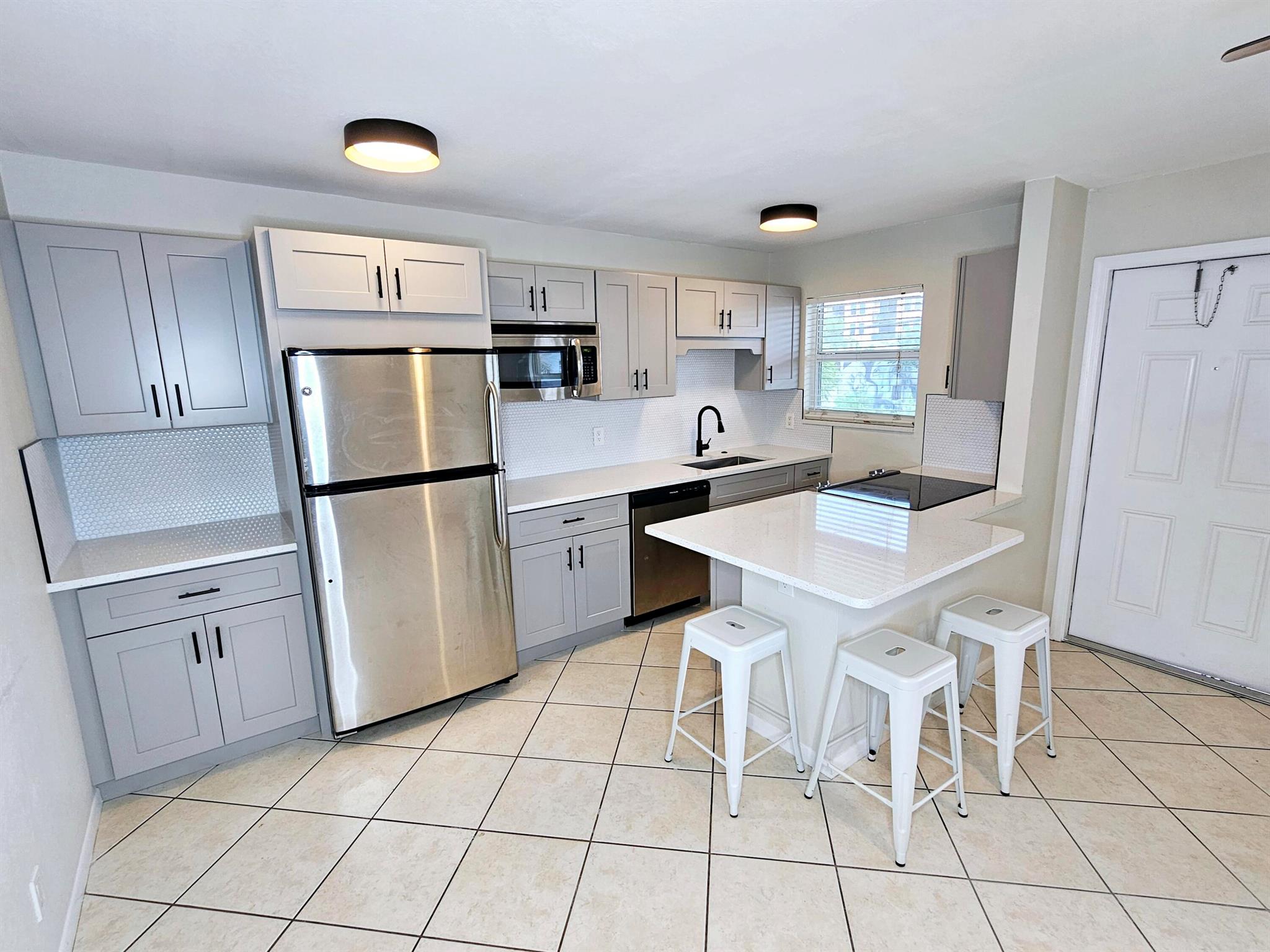 Live in the heart of vibrant Lake Worth Beach with this beautifully updated 1-bedroom, 1-bathroom condo at 111 North L Street #9. This light-filled unit features a newly renovated bathroom and modern kitchen with sleek cabinetry and appliances, a clean, open living space, and stylish finishes throughout. The quiet, well-maintained building offers assigned parking, on-site laundry, and a peaceful residential atmosphere just blocks from all the action. You'll love being just a short walk to Downtown Lake Worth Beach, known for its eclectic mix of coffee shops, restaurants, live music, and local art festivals. Lake Worth Beach and the oceanfront pier are just over a mile away.