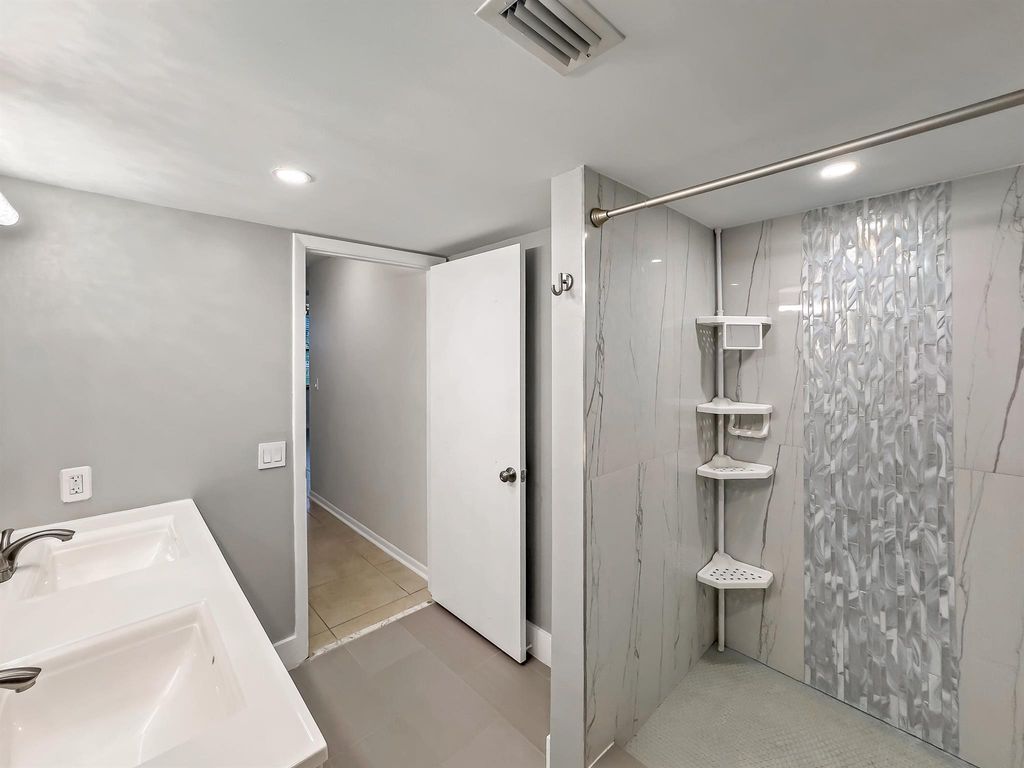 Photo of 2112 S Cypress Bend Drive #104, Pompano Beach, FL 33069 (MLS # R11109162)