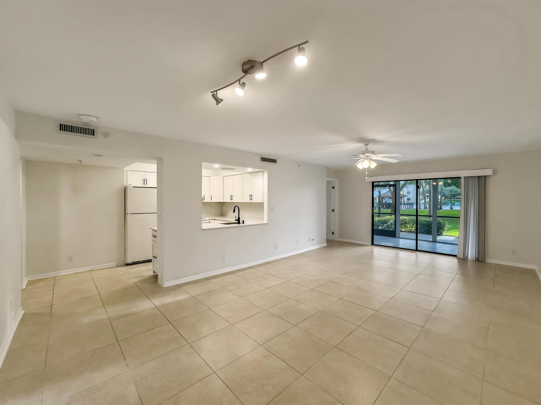 Spacious and beautifully updated 1st-floor condo in the hidden tropical gem of Cypress Bend, a peaceful wildlife sanctuary. Enjoy a large primary suite with patio access, modern double-sink vanity, walk-in shower, and serene lake and pool views. The second bath features stylish finishes with a tub/shower combo. Two private patios--one with sun shutters and one open--perfect for grilling and sunsets. Full-size washer/dryer in hall closet with extra storage. Assigned parking in front, plus guest spaces. Amenities include fitness center, hot tub, and more.