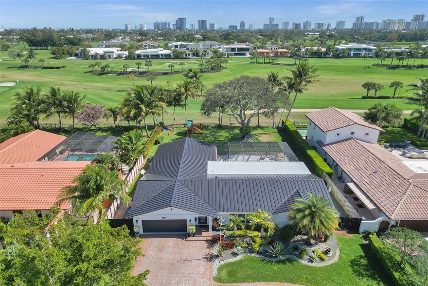 Completely remodeled home on the private Coral Ridge Country Club golf course. Fantastic views. Incredible breeze all year (back yard faces directly East). Very high end remodel with no expense spared- Thermador appliances, HansGrohe fixtures, custom cabinetry in baths and kitchen. All Impact Glass & PVC sewer lines. New Metal roof installed 2024! One of the best porches you will ever see with custom Tongue & Groove ceiling and new built in summer kitchen. Massive backyard is approximately 50'x90' of grass! Beautiful pool area (heated and salt water pool). Custom kitchen has 6 burner gas range, tons of storage and many custom features. Open floor plan with tons of storage and closets. Large bedrooms. Awesome master w/ big bath (steam shwr) and great closets. New AC & Tankless water heater.