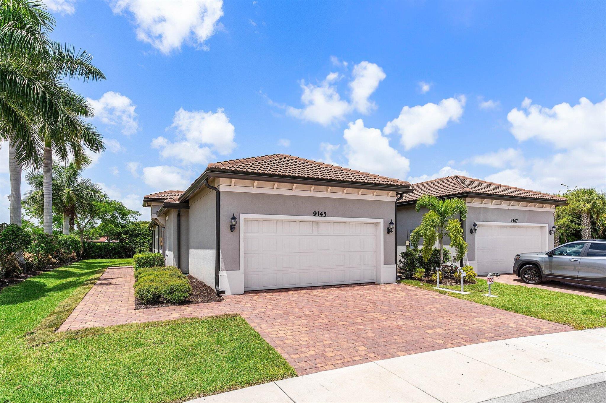 Gorgeous two bedroom plus den, two bathroom villa in the new Boca Flores community. Built in 2021 this villa is clean, spacious and ready immediately. Perfectly located on the corner offering a private entrance and screened patio. Den/office could be converted to a third bedroom. Impact windows and doors throughout, with washer and dryer in utility room and two car garage. The community has a resort style pool, cabana, walking trails and a park. Association fees include: Lawn, security, and Exterior Maintenance and insurance. Boca Flores is an active adult (55+) community. Do not miss this opportunity schedule a private tour today.