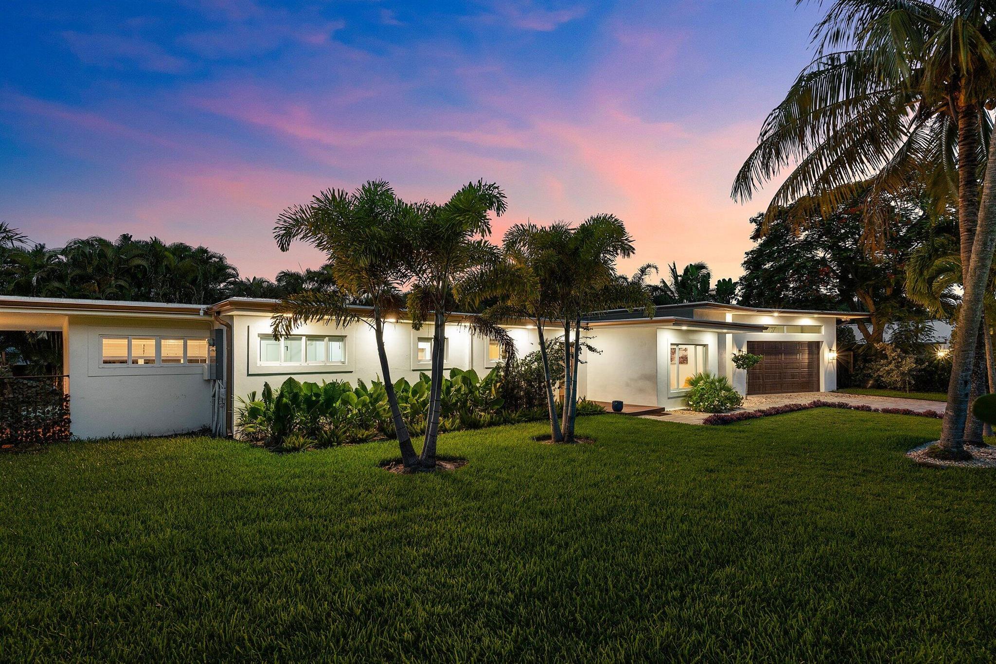 Tucked away on an oversized lot in the heart of Delray Beach's beloved Lake Ida neighborhood, 400 Kings Lynn is a stunning example of Mid-Century Modern design reimagined for today's luxury lifestyle. This rare one-story residence has been completely renovated in 2024 by Stuart and Shelby, blending timeless architectural character with high-end finishes and modern comforts. With five bedrooms--including a detached, fully equipped guest house--this turnkey home offers the perfect blend of privacy, flexibility, and style for both everyday living and entertaining.Step inside and experience spacious, open-concept living filled with natural light, hardwood floors, and sophisticated design elements. The heart of the home is a chef's dream kitchen, featuring a striking oversized island with