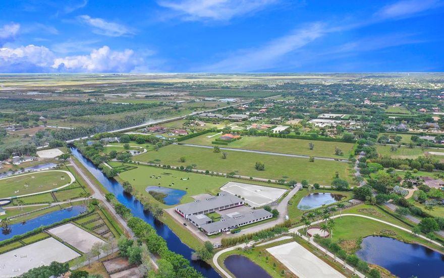 This one has it all! A gorgeous 6Br/6Bth furnished residence with swimming pool, tennis court & top quality equestrian facilities on 16.65 acres. The riders will fall for the 20 stall center-aisle stable with 8 grooming stalls, 2 tack rooms, kitchenette, 3 studio bedroom suites for staff, 3 sets of laundry machines,  200' x 70 ' covered riding arena with lounge, oversized outdoor jumping arena and 5 acre grass grand prix riding field!  Your horses will never get ring sour here!  The bright and airy 7,200 Sq. Ft. residence was renovated in 2016 and boasts a stunning ground-floor master-suite with a spa-like bath. All guest bedrooms have in-suite bathrooms.  The center-Island kitchen has expansive views of the pool and opens to the family room.