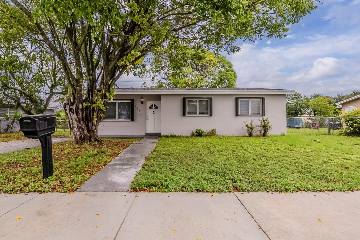 Well-maintained 4-bedroom, 2-bath ranch home in the heart of Miami Gardens, offering a comfortable single-story layout with a spacious living area and tile floors throughout. The kitchen includes ample counter space, an electric range, microwave, and refrigerator, with an adjacent laundry/utility room for added convenience. The primary suite features a walk-in closet and private bath, while the fenced backyard provides room for outdoor enjoyment and entertaining. Situated close to major highways, shopping, dining, and local parks, this home offers both convenience and potential. Some photos have been virtually staged to show potential.