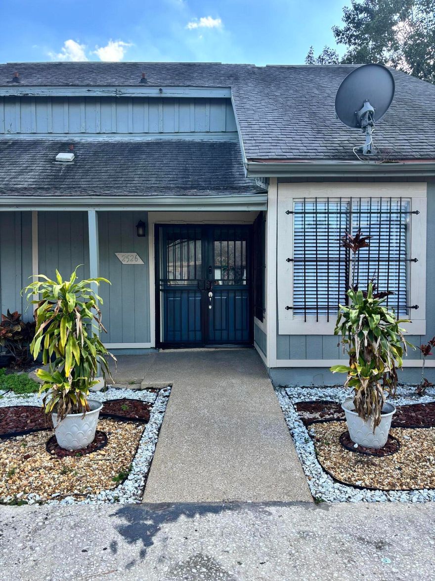 Come see this fully remodeled 3 bedroom, 2 bathroom home with LPV floors throughout. The front double door entrance is beautifully designed with stained glass windows. A spacious laundry room, modern fresh paint and updated light fixtures set the tone for this home. On the first floor there is 1 bedroom, bathroom, living room/ dining room combo and updated kitchen with stainless steel appliances. The kitchen cabinets pop with color and the new sliding doors invite you to cook on the outdoor brick grill. Upstairs you have a second bedroom, bathroom and the Owner's Suite with double entry doors and a spacious oversized closet. Best part of all is you are only a short drive from Disney and minutes away from I-4. Call now to schedule your appointment to see this affordable home.