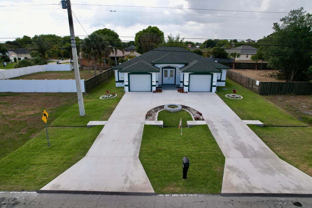 Photo of 3702 SW Port St Lucie Boulevard, Port Saint Lucie, FL 34953 (MLS # R10795715)