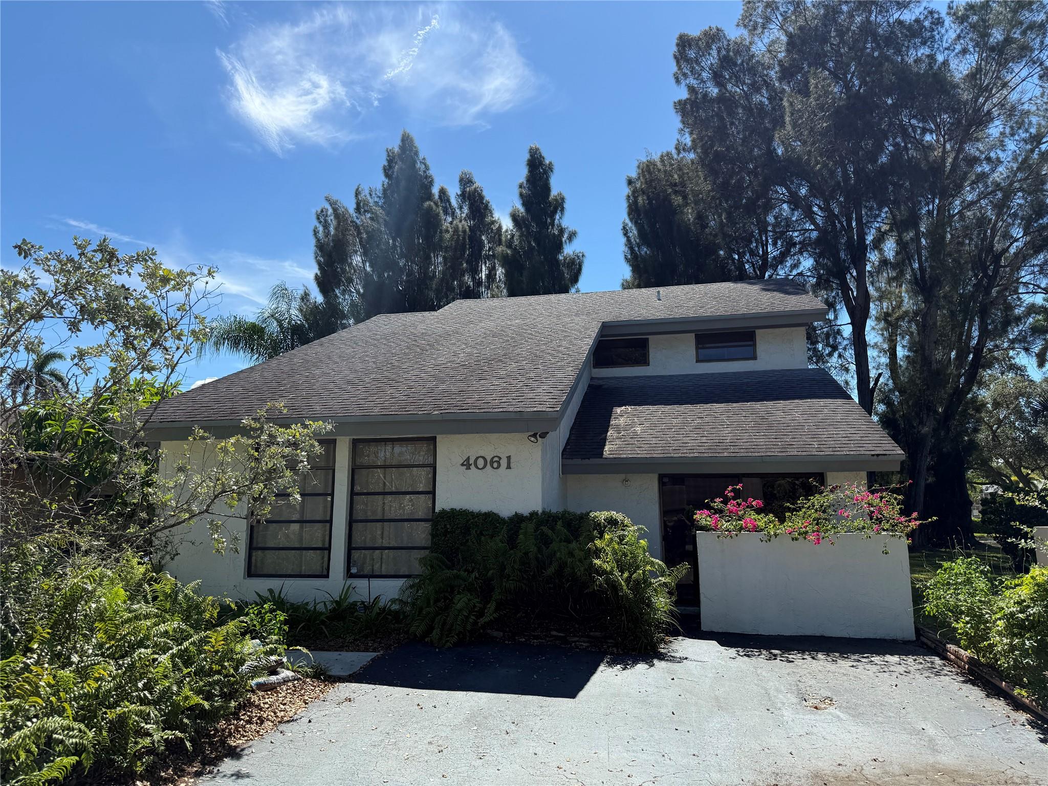 Charming home in ideal Davie location. This bright & beautiful property features high vaulted ceilings, wide open living spaces with dedicated living room, entertainment room, dining room & kitchen with breakfast area. Brand new roof (prior to closing). AC 2015. Nearly 2,000sqft under air. Lush & beautiful backyard is perfect for entertaining, relaxing & tons of room for pool. Loft can be easily converted to 3rd bedroom since there is a closet already in place. Rare opportunity to own in Davie with this square footage at this price. Property is nestled in a quiet serene Davie neighborhood with A+ schools, local parks, great restaurants & everything Davie has to offer. Easy to show.