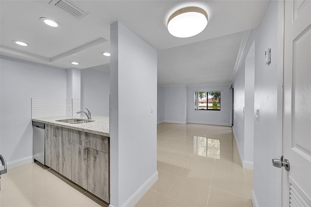 Photo of 10001 W Atlantic Blvd #221, Coral Springs, FL 33071 (MLS # F10540889)