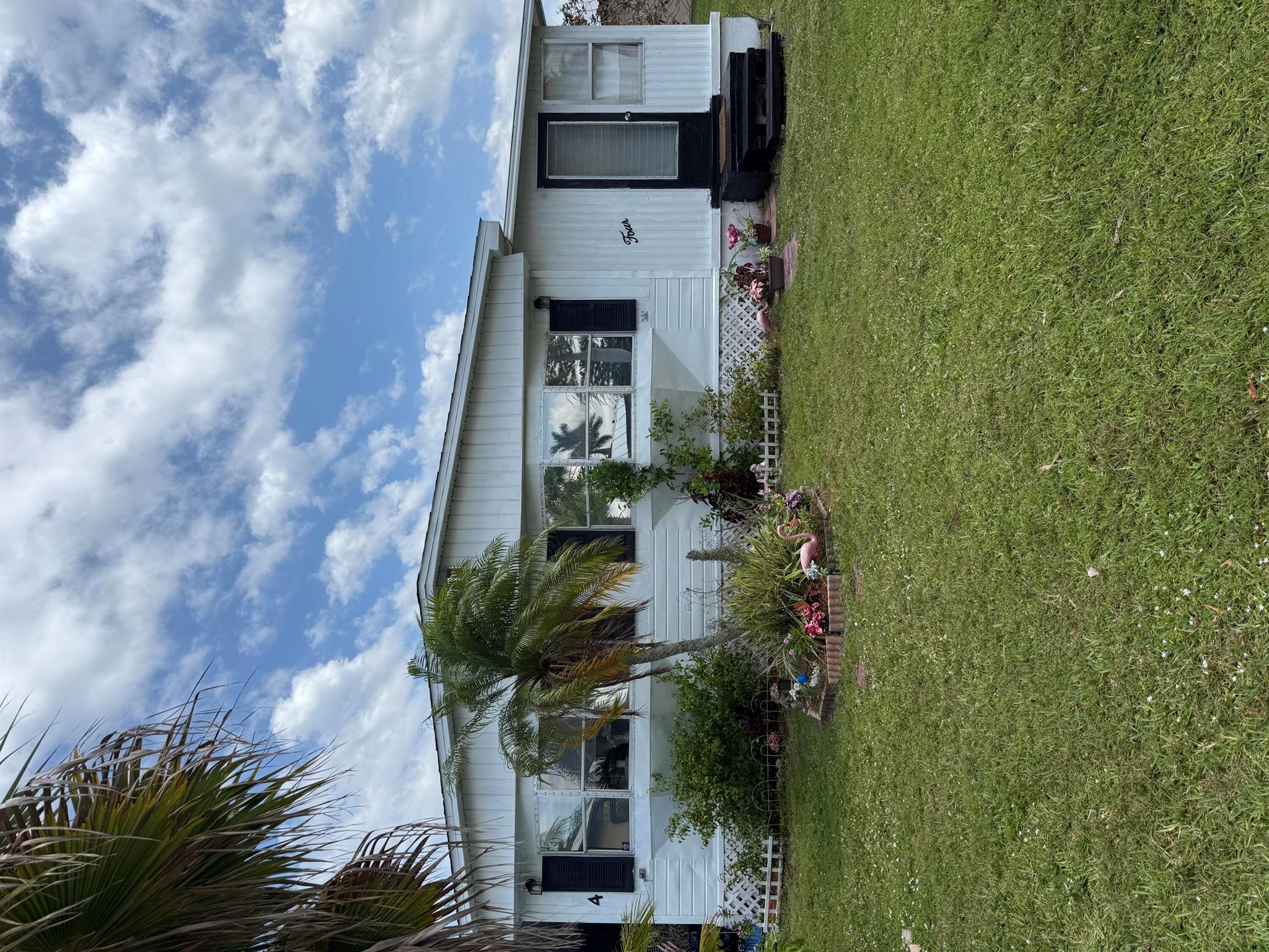 FREE LOT RENT FOR 1 WHOLE YEAR! Welcome to 4 Monterrey Way, a 3-bedroom, 2-bathroom home nestled in the 55+ community of Spanish Lakes in Port St. Lucie. This cozy residence offers over 1,300 square feet of living space, featuring a mix of tile and laminate flooring and rooms ready for your personal touch. AC is 2020. Situated on a large lot with a large carport, the home is one of the largest homes in the park and access to a vibrant community with amenities like a clubhouse, pool, tennis courts, and more. This home is perfect for those seeking comfort, convenience, and a welcoming neighborhood. Don't miss this opportunity to make it your own!