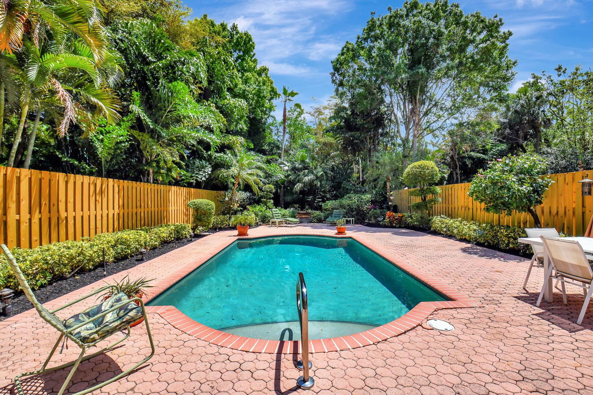 Welcome to your dream home in the sought-after Village of the Banyans, nestled within the prestigious Broken Sound Country Club. This beautifully 3-bedroom, 2.5-bathroom two-story residence offers the perfect blend of comfort, style, and functionality. The spacious primary suite is conveniently located on the main level and features a generous walk-in closet and spa-like bath. Upstairs, you'll find two well-appointed guest bedrooms and a full bath, offering privacy and flexibility for family or visitors. Enjoy soaring volume ceilings that fill the home with natural light, and a bright, open layout ideal for both everyday living and entertaining. The air-conditioned garage adds comfort and versatility, perfect for a home gym or additional storage.