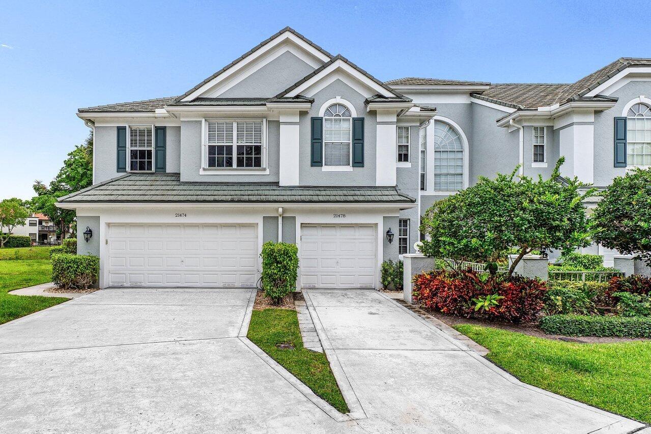 One of the Best Locations within the Community, Stylishly Updated 3 bedroom Corner Townhome w/ Southern Exposure, located just minutes from Town Center Mall, Dining, and Walking Distance to the Boca Raton Swim and Racquet Community Center. Features a Spacious 2-Car Garage with EV Charger, a Renovated Kitchen w/ Quartz Countertops, Engineered Wood Flooring throughout. The Primary Bedroom offers Vaulted Ceilings, and the Spa Inspired Bath includes a Double Vanity with Soaking Tub. Renovated Guest Bath & Powder Room, Enjoy the Covered Screened Patio with No Rear Neighors Desirable Southern Exposure, Perfect for Entertaining. Situated in a Quiet, Gated Community and Zoned for Top-Rated Boca Raton Schools. This Townhouse Offers the Ideal blend of Style, Function, and Unbeatable Location