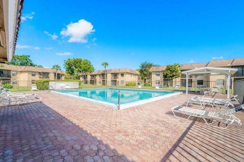 Photo of 6796 Palmetto Circle S #102, Boca Raton, FL 33433 (MLS # R11003874)