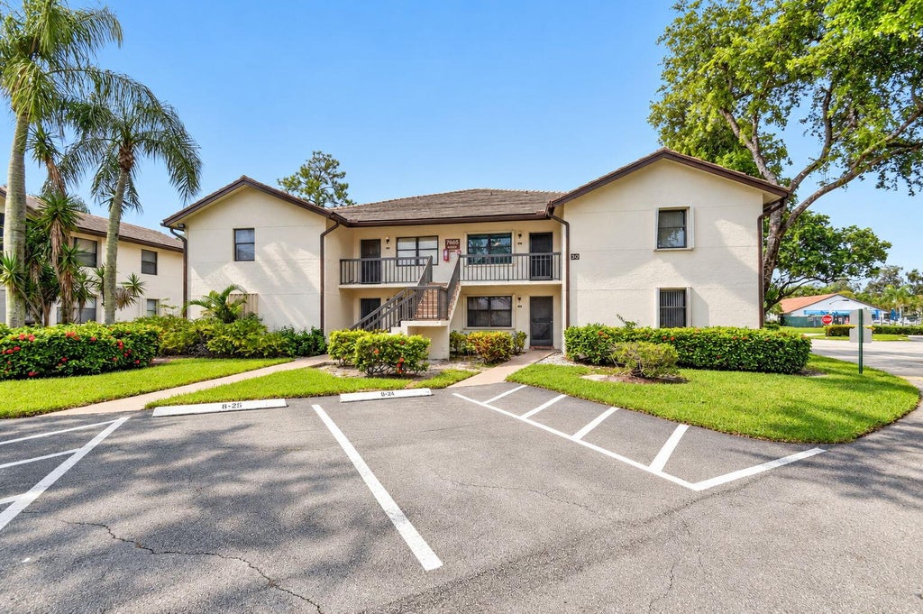 Photo of 7665 TAHITI Lane #104, Lake Worth, FL 33467 (MLS # B26080404)