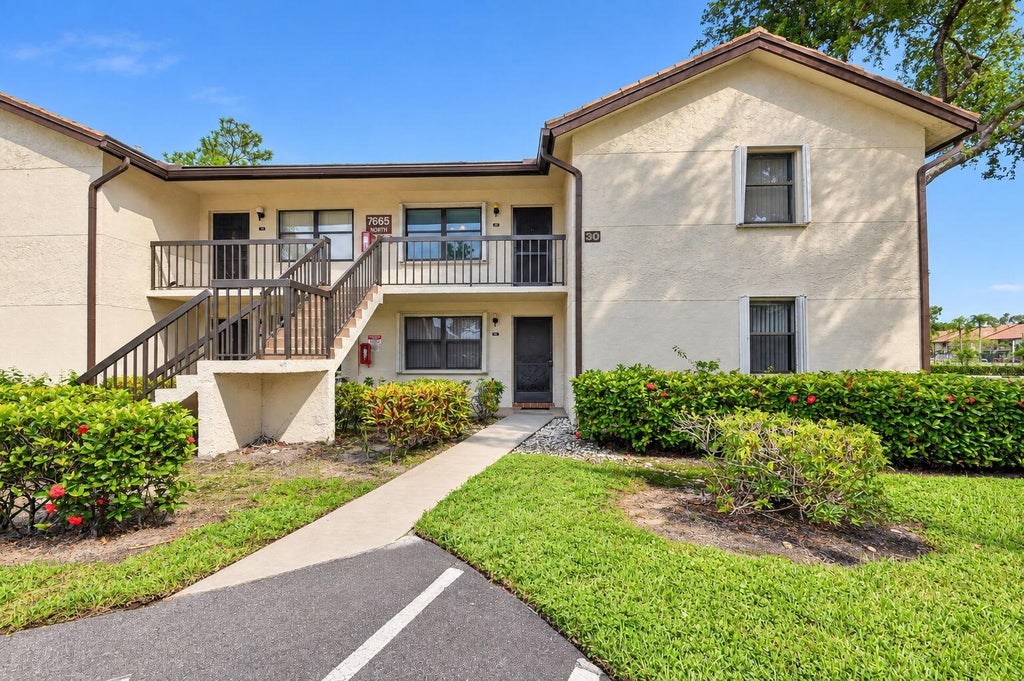 Photo of 7665 TAHITI Lane #104, Lake Worth, FL 33467 (MLS # B26080404)