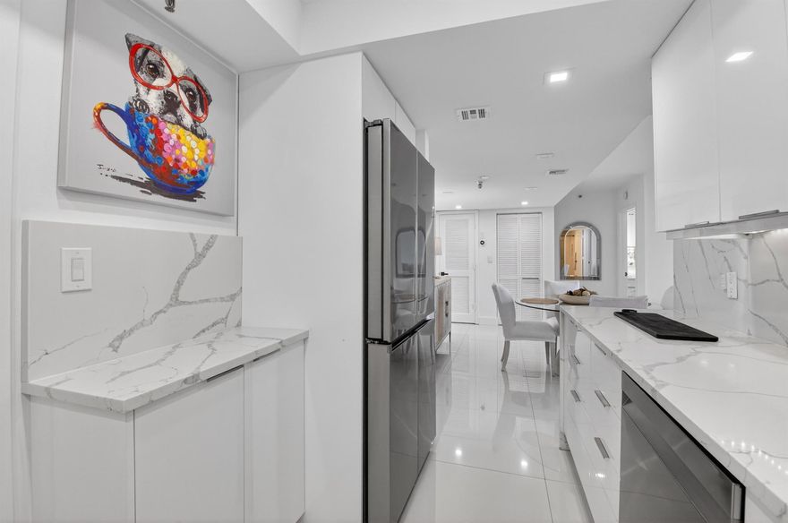 Welcome to 6815 Willow Wood Drive #4083, where refined living meets the unparalleled lifestyle of Boca West Country Club. This top-floor, renovated 2-bedroom, 2-bath residence offers a light-filled retreat with porcelain floors, LED lighting, and a beautifully updated kitchen and baths featuring high-end finishes. Start your mornings on the private balcony, or unwind in the evening while enjoying peaceful views from both bedrooms. With high-end appliances and the convenience of an in-residence washer and dryer, this home is designed for effortless living. A perfect opportunity to enjoy resort-style amenities, world-class dining, golf, racquet sports, and a vibrant social lifestyle--right outside your door.