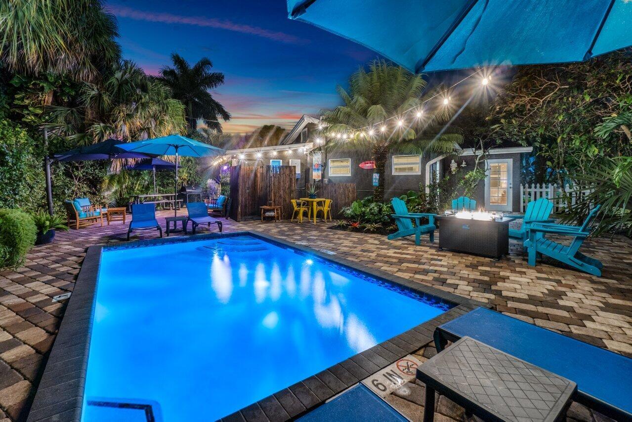 Available starting 11/1/25 through the 2026 Season! Escape to this Private Heated-Poolside Retreat, a luxurious haven in the heart of Downtown West Palm Beach. This captivating mid-century modern paradise offers 2 bedrooms, 2 bathrooms, and a spacious living room with King-Size pull out, accommodating up to 6 guests. Every corner is adorned with carefully selected, brand-new furnishings for your comfort & style. Step into a world of Old Florida nostalgia and carefree charm with vibrant mid-century modern decor. The living space is designed for ultimate entertainment. Outside, the lush landscape surrounds a private oasis, complete with a heated pool, invigorating outdoor bamboo shower, fire pit, and BBQ area.