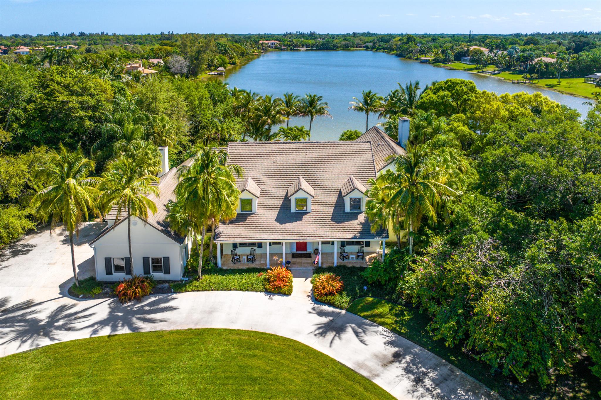 Built as a ''Forever Home'' on a gorgeous acre of lakefront property, this 6600 square foot, 7-bedroom oasis boasts a secluded paradise for the entire family to enjoy. Beautiful and timeless, this sensational colonial style home boasts 150 ft of lake frontage and was constructed with purpose, functionality and longevity in mind. The original (and only) owners of this estate, were personally invested in the design, the quality of the construction and the choice of Banyan Estates for its location. Banyan Estates is a unique and desirable water sports community: boating, water skiing, kayaking, jet skiing and fishing from the backyard or community boat ramp. An intimate neighborhood of 41 large home sites, low HOA, gated entrance and tennis courts. Banyan Estates is truly a unique place!